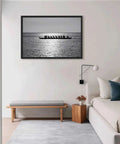 Rowing Team Silhouette Canvas Print With Black Frame, Modern Ocean Landscape Wall Art displayed above sofa in living room