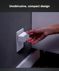 Hand plugging Hue Smart Plug into a wall socket, turning any lamp into a smart light with no fuss via voice or app control