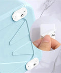Self-Adhesive 360-Degree Caster Wheel Set Stainless Steel With ABS Slick Quiet Glide applied to blue plastic surface
