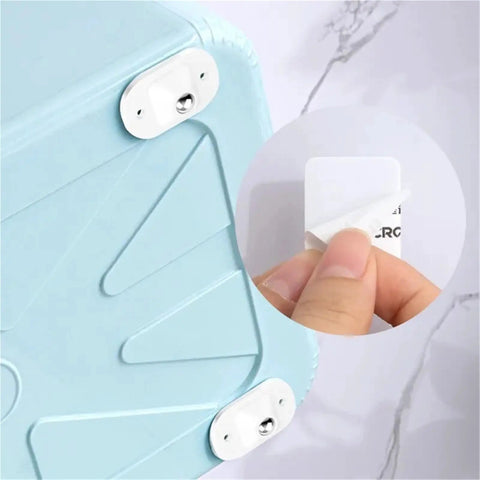 Self-Adhesive 360-Degree Caster Wheel Set Stainless Steel With ABS Slick Quiet Glide applied to blue plastic surface