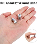 Super Sparkle 16-Pack Crystal Glass Cabinet Knobs With Shiny Aluminum Bases on a hand, showcasing mini size and design.