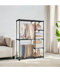 Portable Freestanding Closet Organizer With A Super Solid Heavy Duty Metal Frame And Roomy Shelves For Sneakers And Threads Sleek Bedroom Wardrobe Rack Featuring Durable Hanging Rods Straight Forward Setup All In One Space Saving Solution displaying clothes and accessories.