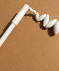 22 Piece PTFE Magnetic Stir Bar Set With Retriever showing oval-shaped Teflon stir bars on a brown background