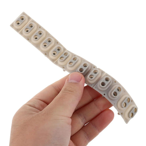 Person holding a DIY Friendly Silicone Key Contact Strip For 13 Key Digital Pianos And Electronic Keyboards Replacement.