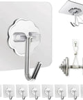 Clear Adhesive Wall Hooks With Hella Strong Peel And Stick Backing For Kitchen Bathroom Office Storage Solid Invisible Hold Saves Floor Space Zero Drilling Hassle Free Mount Keeps Spaces Tidy Pack Of Ten displaying ten hooks with transparent backing and chrome hooks for organization.