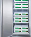 Beefy Frost Free Upright All Freezer Delivering Solid Twenty Three Cubic Feet Chill Capacity Digital Thermostat Interface And Sleek Stainless Steel Build with open door and shelves filled with boxes.