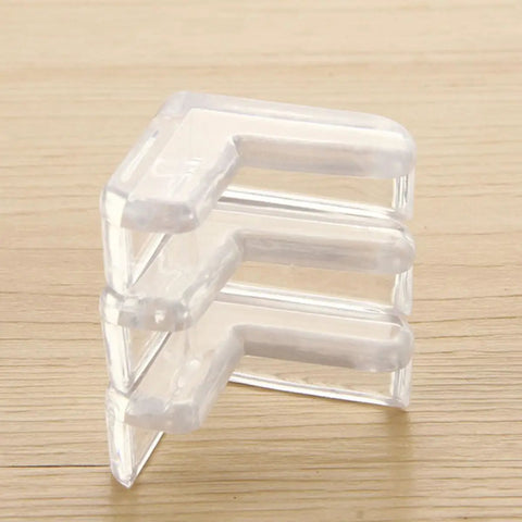 White PVC Corner Protectors For Tables And Cabinets, Heavy Duty Adhesive Edge Guards, stack of three on wooden surface