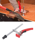 Heavy Hitter Ratchet Bench Dog Clamp For MFT Table Tops With 20Mm Dog Hole Base, shown using wood piece for sawing.