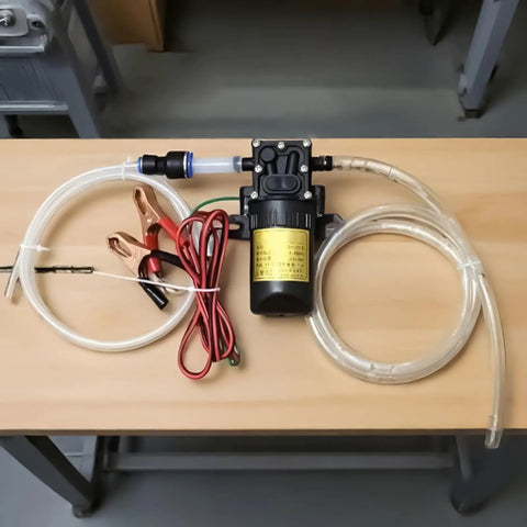 Heavy Duty 12V Self Priming Transfer Oil Pump For Garage And Shop Fluid Extractor, includes hoses and clips for easy use.