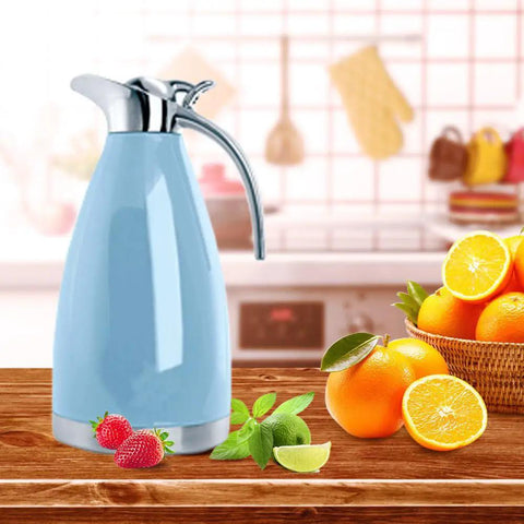 68 Oz Stainless Steel Coffee Carafe With Double Wall Vacuum Insulation Keeps Your Brew Hot Up To 12 Hours Or Cold Up To 24 Hours, 2 Liter Capacity, Blue on kitchen counter with citrus fruits.