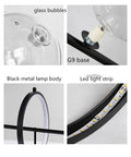 Close-up details of High Quality Top Shelf Modern Metal Chandelier With Clear Glass Bubbles And G9 Sockets showing glass bubbles, G9 base, and black metal lamp body.