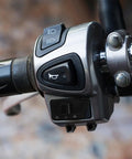Durable Handlebar Turn Signal Switch For Motorbikes Electric Bikes And Scooters With Smooth Sensitive Operation And Safe Reliable Signal Plastic Construction Easy Mount Wide Compatibility For Daily Commutes And Weekend Rides installed on a handlebar