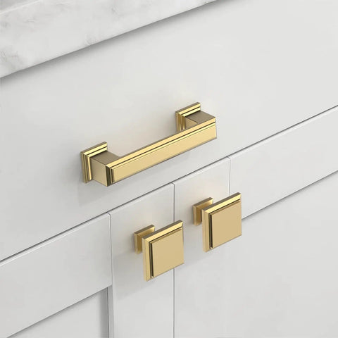 Gold cabinet handle and knobs on white kitchen cabinet for an elegant look