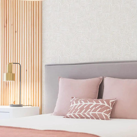 Bedroom with Sand Swirl Swell Removable Peel And Stick Wallpaper With Retro Curves, 20.5 In Wide By 16.5 Ft Long behind a bed