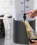 5 Gallon Commercial Cold Brew System For Home Office Or Small Cafe That Lets You Brew Big Batches For A Week Or More Plus No Mess Spigot And Food Grade Materials With A Handy Recipe Guide Included in use with a spigot pouring coffee