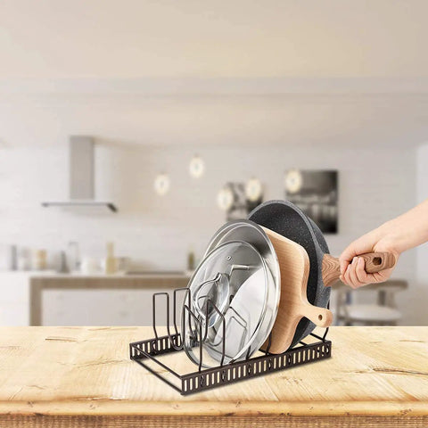 Sturdy Pot Lid Storage Rack With Seven Adjustable Compartments For Countertops And Cabinets Keeping Bakeware Pan Covers And Plates Super Secure in black.
