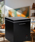 Hella Spacious 7.0 Cu.Ft Chest Freezer In Bold Black in modern home setting, featuring adjustable thermostat and smooth-slide baskets.