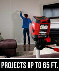 Man using 65 Ft Green Cross Line Laser Level With Self Leveling, USB Rechargeable Battery for precise wall alignment.