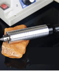 Jade Carving Machine Bench Grinder Polisher Cutting Tool Electric Stone Workbench with silver handle on stone base.