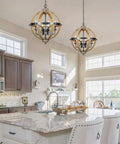 Orb Four Light Farmhouse Chandelier in Stardust Brown with wood accents hanging over kitchen island, cozy rustic vibe