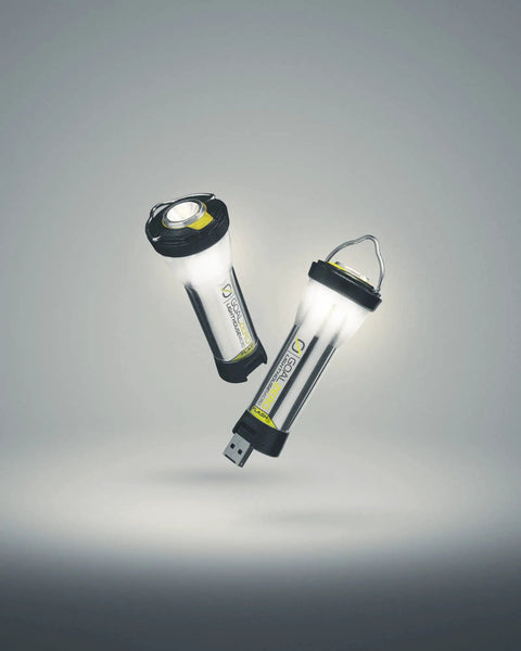 Two Lighthouse Micro Flash Lantern USB Rechargeable Handheld Light for Emergency Outdoor Use in a grey background.