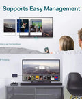 Couple using 8 Port Gigabit Ethernet Switch With No Fuss Setup And Easy Smart Management For Desktop Or Wall Mount, enjoying media