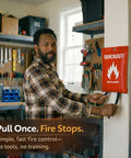 Person in workshop installing fire blanket survival cover for kitchen and home safety heat protection against small cooking fires