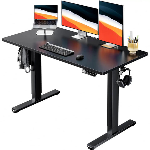 Electric Standing Desk With Real Deal One Piece Desktop Adjustable Height For Sit Stand Four Memory Settings 48 By 24 Inches Heavy Duty Steel Frame Built To Last Home Office Desk Black showing dual monitors and keyboard setup.
