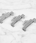 12 Piece DIN Rail End Stops Kit For 35mm Rails With Screw Clamps Galvanized Iron Alloy Ends That Lock Terminal Blocks No Slip And Secure Components In Electrical Panels And Control Cabinets, three silver stops