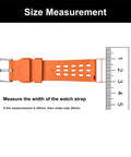 Orange watch strap beside ruler measuring width, highlighting size measurement for accurate fit.