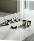 Industrial Spring Plunger Pins 4 Pack placed near pliers and sockets on a marble surface for heavy duty projects.