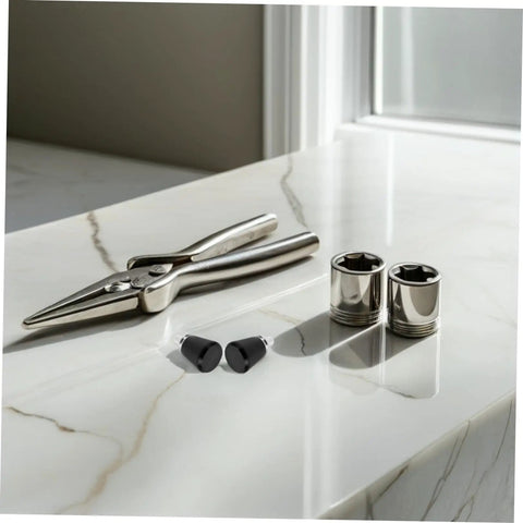 Industrial Spring Plunger Pins 4 Pack placed near pliers and sockets on a marble surface for heavy duty projects.