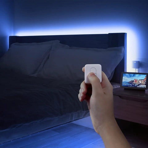 Person using One Tap Smart Remote For Your Home Automation Needs Works With Curtain Bot Color Bulb LED Strip Blind Tilt And Plug Mini Bluetooth Five Point Zero Long Range Easy Control No Phone Required.