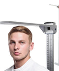 Professional Wall Mounted Stadiometer With Pro Grade Telescopic Metal Height Rod MR-230, Precise Height Measurement Tool For Clinics, Up To 90 Inches, Footpiece Positioner, Durable Medical Grade. Man measuring height with wall-mounted stadiometer