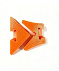 Two orange plastic Rock Solid 90 Degree Corner Clamp Adapter pieces for woodworking right angle jig assembly.
