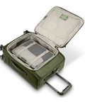 Open Lineate Softside Expandable Go To Carry On Luggage With Spinner Wheels Cedar Green showing interior packing space and straps.