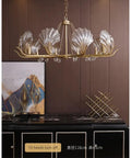 Modern Gold Steel Led Pendant Light Featuring Polished Cyan Crystals Dimmable Round Ceiling Lamp For Living Room with shell design.