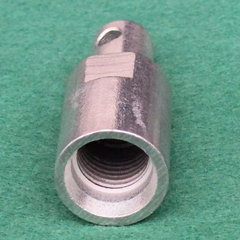 Close-up of Electric SDS Shank Converter Adapter for Drill Bits and Power Tools Pro Grade, heavy duty metal on green background.