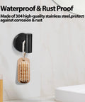 Two Pack Stainless Steel Black Matte Towel Hooks For Wall Mount And Door Hanger, holding brush in bathroom setting