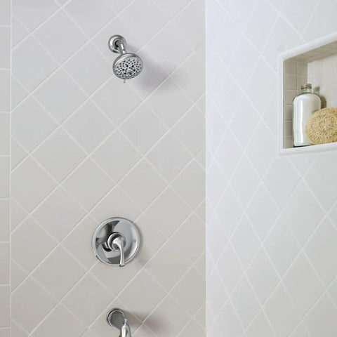 Chrome shower set featuring Idora Single Handle Posi Temp Tub And Shower Faucet With Valve Included on white tiled wall.