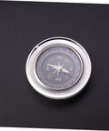 Pro Grade Watch Repair Compass Tool For Precision Dial Alignment And Testing Handy Jeweler Compass with metal casing on black surface.