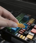 Hand using puller from Car Fuses Assortment Kit 1200 Pieces with 520 Standard Fuses and 680 Pullers, 2A to 40A Zinc, Color Coded
