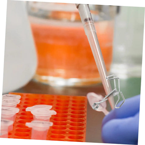 Lab setup with Flow Control Tubing Clamps Pack Of 10, Spring Water Stop Clips, used during a pipetting process in a test tube rack