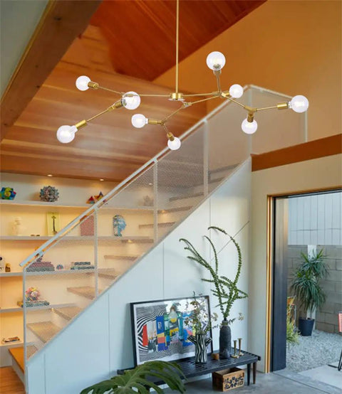 Gold 9 Light Sputnik Chandelier Modern Metal Ceiling Hanging Light Adjustable Pendant Fixture in a modern living room setting