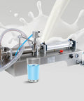 Heavy Duty Stainless Steel Pneumatic Bottle Filler With No Sweat Assembly And Next Level Precision For Cosmetics Olive Oil Wine And Spirits Designed For 500 To 5000 Ml Containers Daily, shown pouring liquid into a glass.