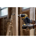Heavy Hitter 20V Max Brushless Compact Drill Driver Boasting 1/2 Inch Ratcheting Chuck And 404 Uwo Torque, Pumping Out 1650rpm Revolutions Plus Bright Led Lights For No Sweat Job Site Hustle, Tool Only in action drilling wood.
