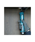Super Compact Cordless Pencil Drill Offering Slick Ratchet Action And 21 Position Torque Control Built Tough For Cramped Spaces And Weekend Repair Work Lightweight Body With Handy Led Lamp in use, held in hand with LED on.