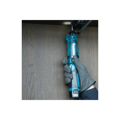 Super Compact Cordless Pencil Drill Offering Slick Ratchet Action And 21 Position Torque Control Built Tough For Cramped Spaces And Weekend Repair Work Lightweight Body With Handy Led Lamp in use, held in hand with LED on.