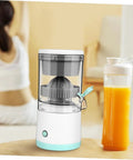 Premium Portable Electric Citrus Juicer, Powerful 45W Motor With Retractable Blade, Fast Press Fruit Extractor in a home setting with fresh juice.