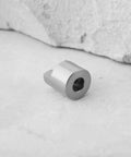 Close-up of a single stainless steel drive dog from the 10 Piece Stainless Steel Drive Dogs Propeller Adapter Set For RC Boat Shaft 3mm Fits 3mm Shafts On Electric And Gas Powered Boats For Pro Grade Solid Secure High Speed Power Transfer.